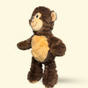 Large Plush monkey dog toy on a beige background