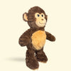 Large Plush monkey dog toy on a beige background