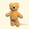 Large Plush Hairy Barry teddy bear dog toy on a beige background
