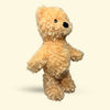 Large Beige Hairy Barry stuffed bear dog toy on a beige background