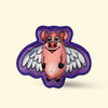 Hairy Barry Cartoon pig with wings flying dog toy on a beige background